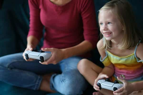 mother daughter video gaming together
